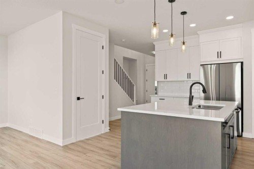 494 Kinniburgh Loop, Chestermere, AB - Indoor Photo Showing Kitchen With Upgraded Kitchen