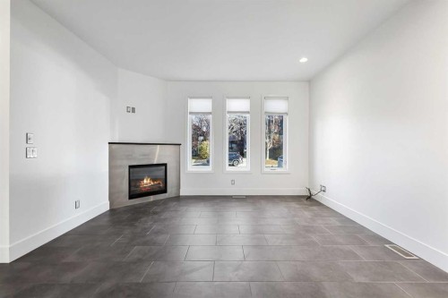 2013 24A Street Sw, Calgary, AB - Indoor Photo Showing Living Room With Fireplace