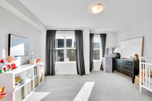 128 Cranbrook Square Se, Calgary, AB - Indoor Photo Showing Bedroom