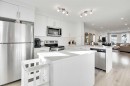 128 Cranbrook Square Se, Calgary, AB  - Indoor Photo Showing Kitchen With Stainless Steel Kitchen With Upgraded Kitchen 