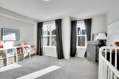 128 Cranbrook Square Se, Calgary, AB - Indoor Photo Showing Bedroom