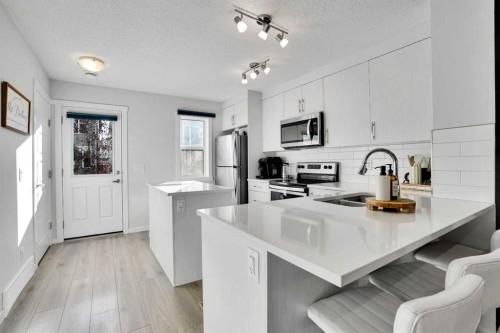 128 Cranbrook Square Se, Calgary, AB - Indoor Photo Showing Kitchen With Stainless Steel Kitchen With Upgraded Kitchen