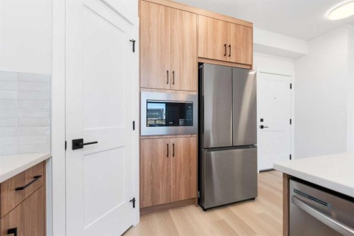 7211-1802 Mahogany Boulevard Se, Calgary, AB - Indoor Photo Showing Kitchen