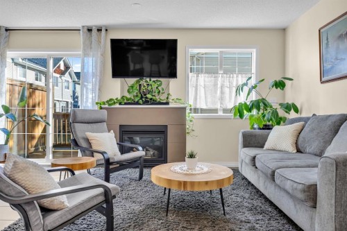 128 Country Village Manor Ne, Calgary, AB - Indoor Photo Showing Living Room With Fireplace