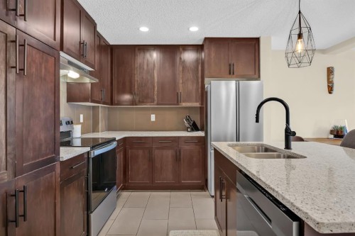 128 Country Village Manor Ne, Calgary, AB - Indoor Photo Showing Kitchen With Stainless Steel Kitchen With Double Sink With Upgraded Kitchen