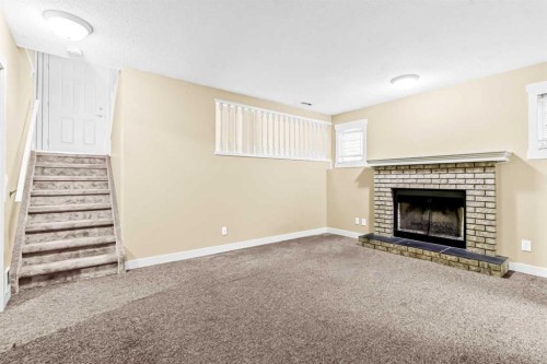 16279 10 Street Sw, Calgary, AB - Indoor Photo Showing Living Room With Fireplace