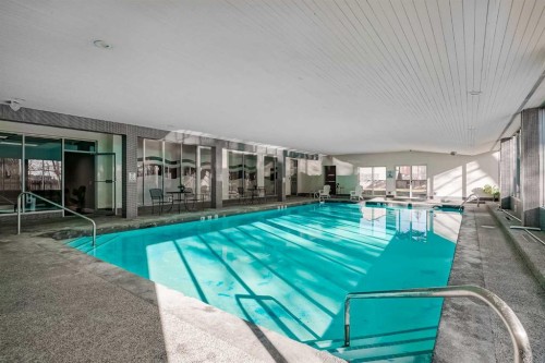 307-4944 Dalton Drive Nw, Calgary, AB - Outdoor With In Ground Pool