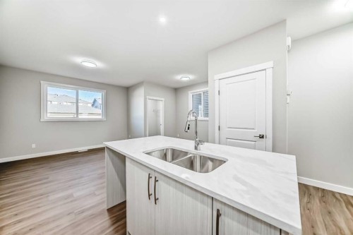 144 Belvedere Park Se, Calgary, AB - Indoor Photo Showing Kitchen With Double Sink
