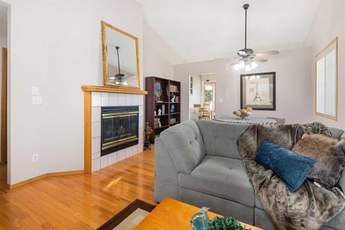 17-1200 Milt Ford Lane, Carstairs, AB - Indoor Photo Showing Living Room With Fireplace