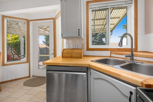 17-1200 Milt Ford Lane, Carstairs, AB - Indoor Photo Showing Kitchen With Double Sink