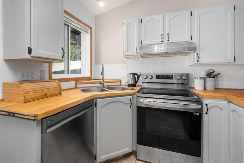 17-1200 Milt Ford Lane, Carstairs, AB - Indoor Photo Showing Kitchen With Double Sink