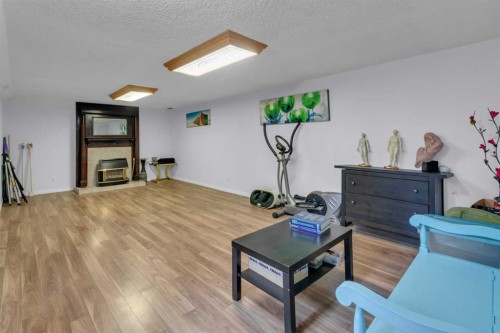 5122 48 Street Nw, Calgary, AB - Indoor With Fireplace