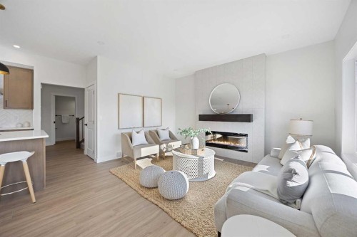 1398 Bayview Crescent Sw, Airdrie, AB - Indoor Photo Showing Living Room With Fireplace