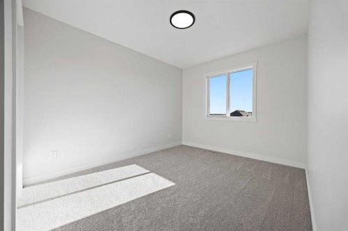 1398 Bayview Crescent Sw, Airdrie, AB - Indoor Photo Showing Other Room