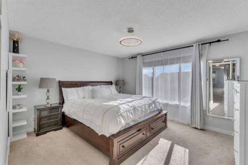 1535 Ravensmoor Way Se, Airdrie, AB - Indoor Photo Showing Bedroom