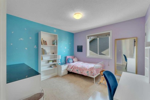1535 Ravensmoor Way Se, Airdrie, AB - Indoor Photo Showing Bedroom