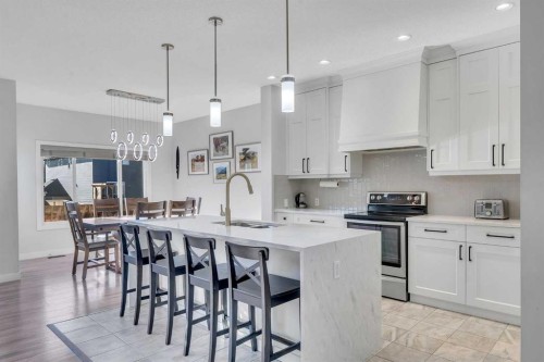 1535 Ravensmoor Way Se, Airdrie, AB - Indoor Photo Showing Kitchen With Upgraded Kitchen