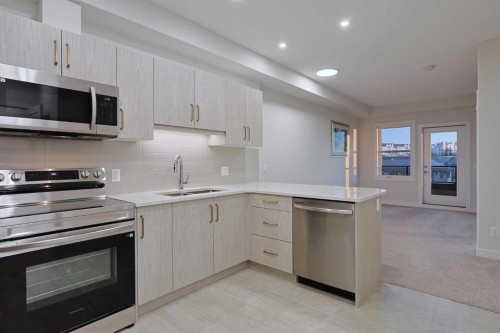 1401-81 Arbour Lake View Nw, Calgary, AB - Indoor Photo Showing Kitchen With Stainless Steel Kitchen With Double Sink