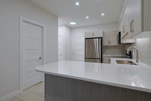 1401-81 Arbour Lake View Nw, Calgary, AB - Indoor Photo Showing Kitchen With Double Sink