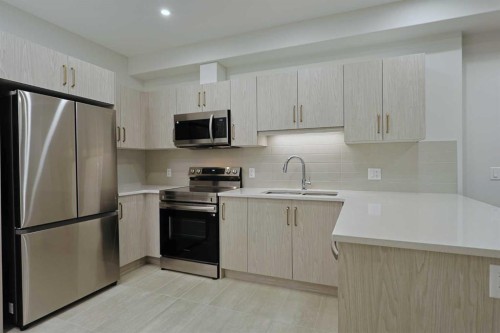 1401-81 Arbour Lake View Nw, Calgary, AB - Indoor Photo Showing Kitchen With Stainless Steel Kitchen With Double Sink