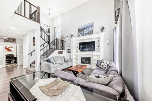 1368 Lackner Boulevard, Carstairs, AB - Indoor Photo Showing Living Room With Fireplace