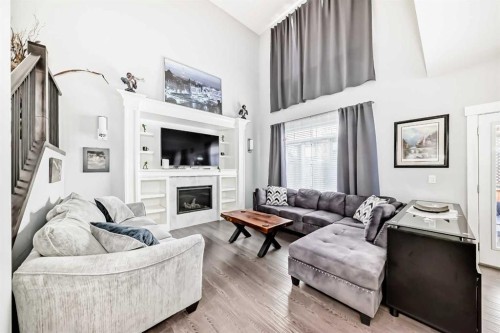 1368 Lackner Boulevard, Carstairs, AB - Indoor Photo Showing Living Room With Fireplace