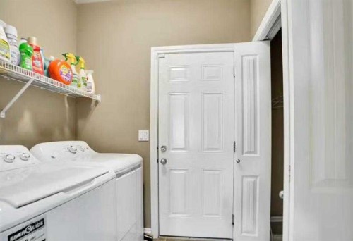 1065 Channelside Drive Sw, Airdrie, AB - Indoor Photo Showing Laundry Room