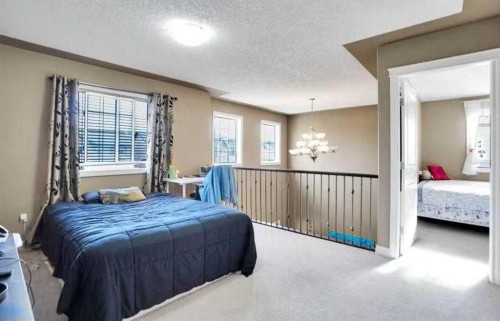 1065 Channelside Drive Sw, Airdrie, AB - Indoor Photo Showing Bedroom
