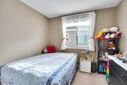 1065 Channelside Drive Sw, Airdrie, AB - Indoor Photo Showing Bedroom