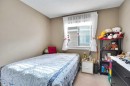 1065 Channelside Drive Sw, Airdrie, AB  - Indoor Photo Showing Bedroom 