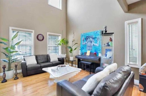 1065 Channelside Drive Sw, Airdrie, AB - Indoor Photo Showing Living Room