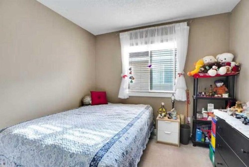 1065 Channelside Drive Sw, Airdrie, AB - Indoor Photo Showing Bedroom