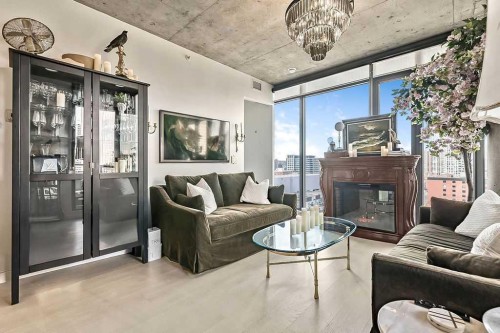 903-1010 6 Street Sw, Calgary, AB - Indoor Photo Showing Living Room With Fireplace