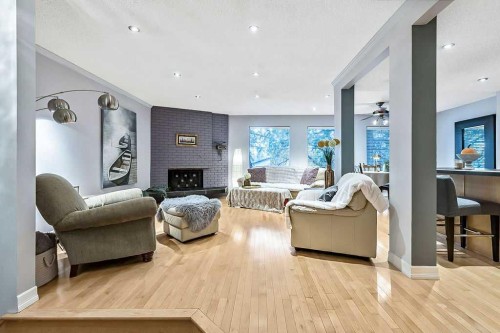 5279 Dalcroft Crescent Nw, Calgary, AB - Indoor Photo Showing Living Room With Fireplace