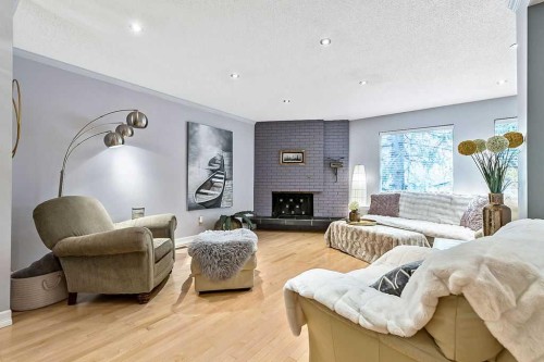 5279 Dalcroft Crescent Nw, Calgary, AB - Indoor Photo Showing Living Room With Fireplace