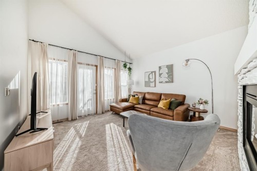 58 Panatella Lane Nw, Calgary, AB - Indoor Photo Showing Living Room With Fireplace