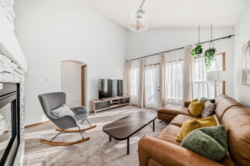 58 Panatella Lane Nw, Calgary, AB - Indoor Photo Showing Living Room With Fireplace