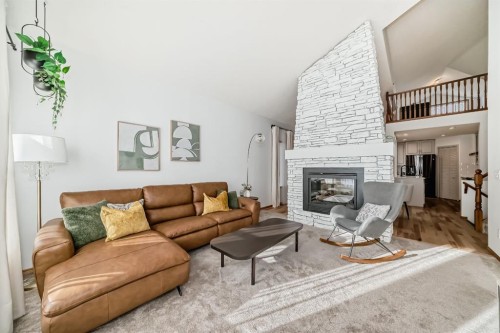 58 Panatella Lane Nw, Calgary, AB - Indoor Photo Showing Living Room With Fireplace