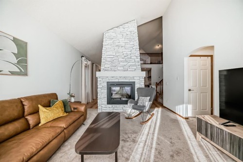 58 Panatella Lane Nw, Calgary, AB - Indoor Photo Showing Living Room With Fireplace