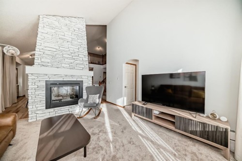 58 Panatella Lane Nw, Calgary, AB - Indoor Photo Showing Living Room With Fireplace