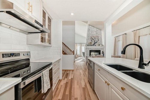 58 Panatella Lane Nw, Calgary, AB - Indoor Photo Showing Kitchen With Double Sink