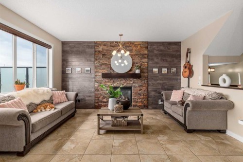 40 Heritage Hill, Cochrane, AB - Indoor Photo Showing Living Room With Fireplace