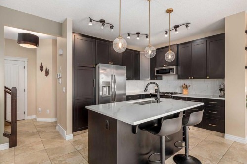 40 Heritage Hill, Cochrane, AB - Indoor Photo Showing Kitchen With Double Sink With Upgraded Kitchen