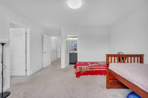 165 Hotchkiss Way Se, Calgary, AB - Indoor Photo Showing Bedroom