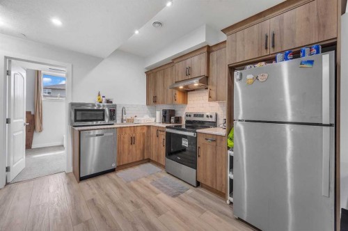 165 Hotchkiss Way Se, Calgary, AB - Indoor Photo Showing Kitchen With Stainless Steel Kitchen