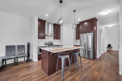 165 Hotchkiss Way Se, Calgary, AB - Indoor Photo Showing Kitchen With Stainless Steel Kitchen With Double Sink With Upgraded Kitchen