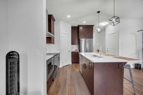 165 Hotchkiss Way Se, Calgary, AB - Indoor Photo Showing Kitchen With Stainless Steel Kitchen With Double Sink With Upgraded Kitchen