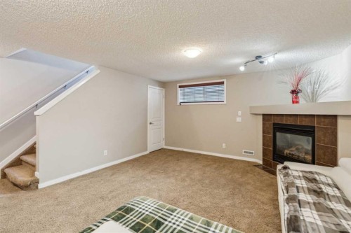 22 Auburn Bay View Se, Calgary, AB - Indoor With Fireplace