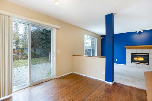 29 Spring Crescent Sw, Calgary, AB - Indoor Photo Showing Other Room With Fireplace