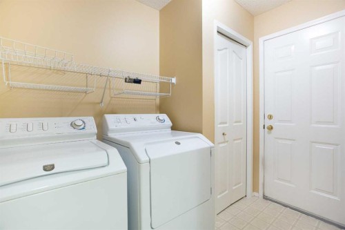 29 Spring Crescent Sw, Calgary, AB - Indoor Photo Showing Laundry Room